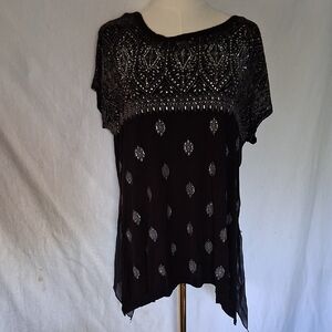 B.L.E.U  Black Asymmetrical Graphic Blouse. It Has a Sheer Bottom In The Back.